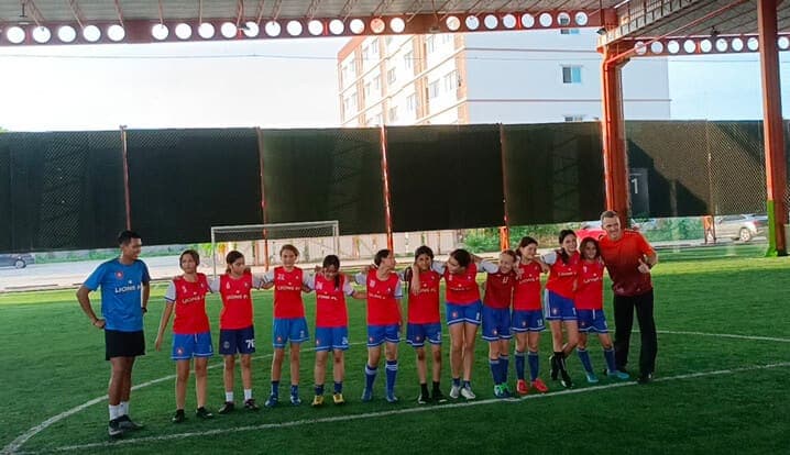 The squad lined up with their coaches on the covered pitch