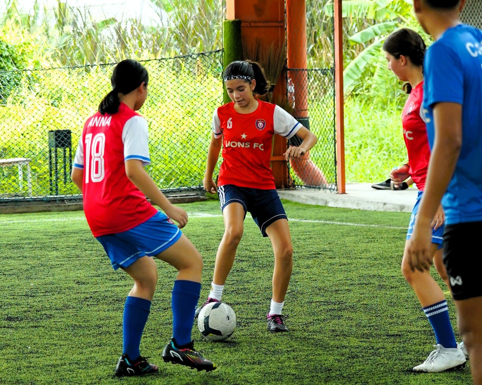 A passing drill in training, two players closing down the one on the ball