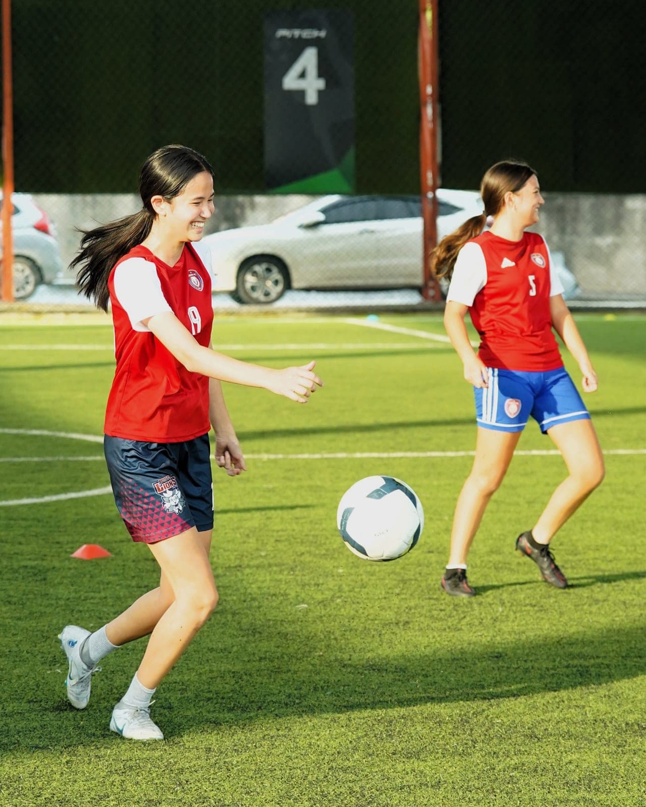 A drill with a visiting coach, two players closing down the ball