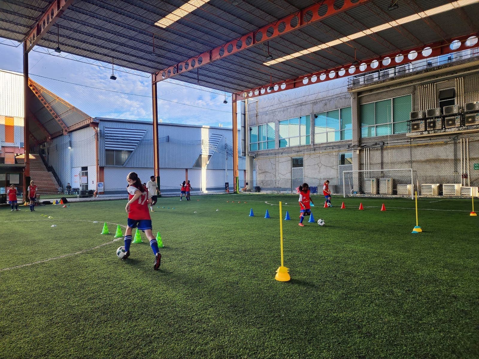 The covered artificial pitch at SoccerPro Bangna laid out with cones for a Lions FC training session